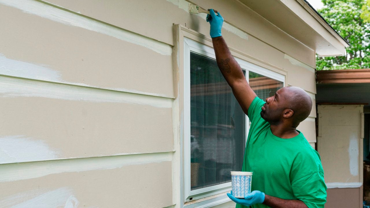 Man painting house